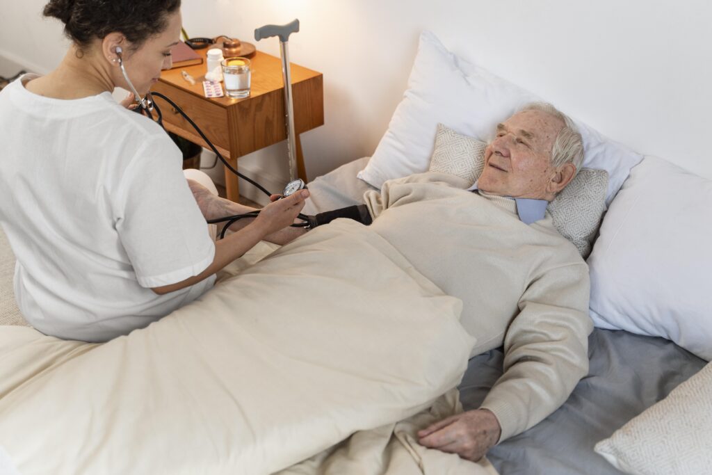 Elderly woman receiving compassionate bedridden patient care from a trained nurse in Hyderabad