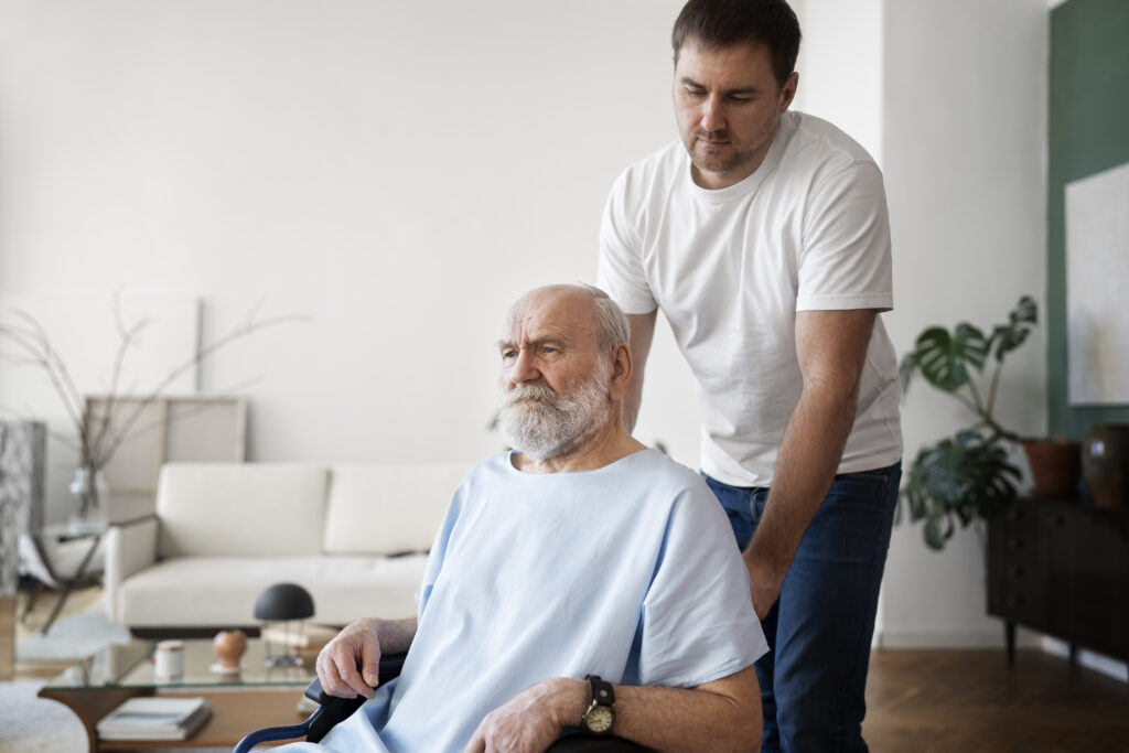 Physiotherapist helping an elderly Parkinson’s patient with exercises