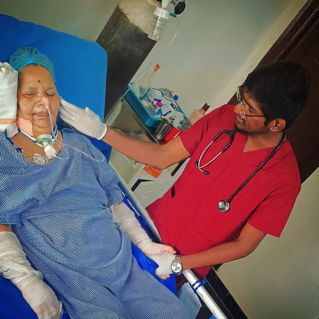 Nurse providing tracheostomy care to elderly patient at Nova Rehabilitation and Palliative Care Center in LB Nagar Hyderabad
